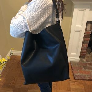 Barney New York unlined Hobo Style handbag. Black.